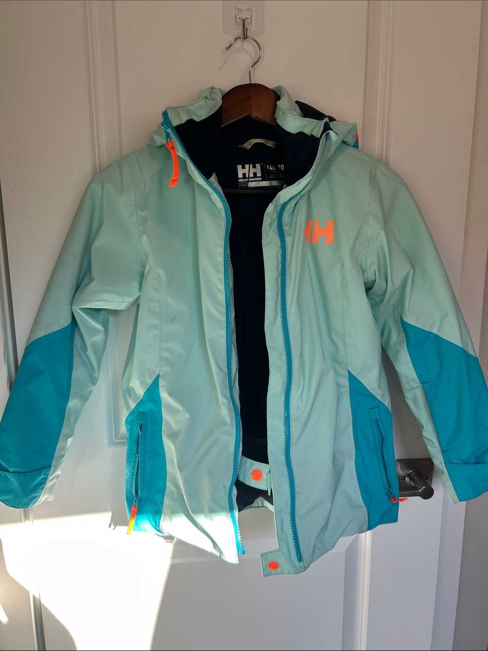 Helly Hansen Mint and Teal Kids' Waterproof Snowboard Jacket with Orange Accents